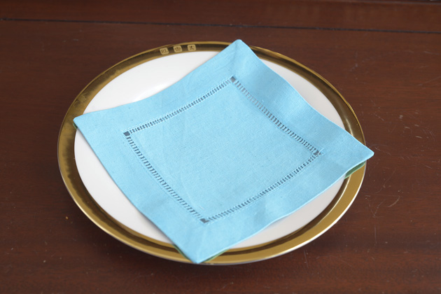 Hemstitch Cocktail Napkin. Blue Atoll color