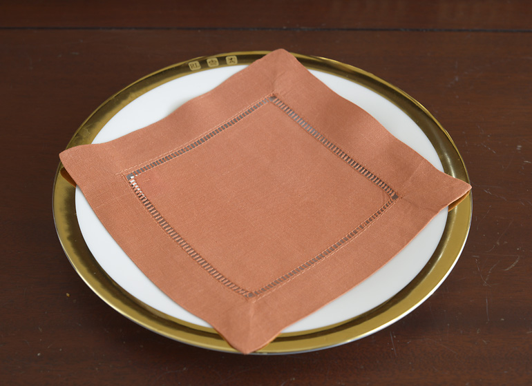Peach Caramel color hemstitch cocktail napkin.