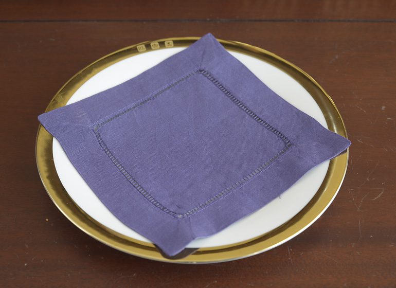 Imperial purple color hemstitch cocktail napkin.