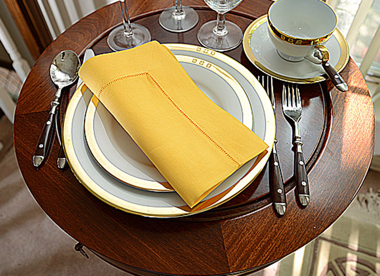 kumquat color hemstitch napkin.